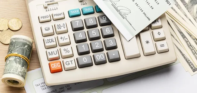high-angle-calculator-cash-arrangement.webp